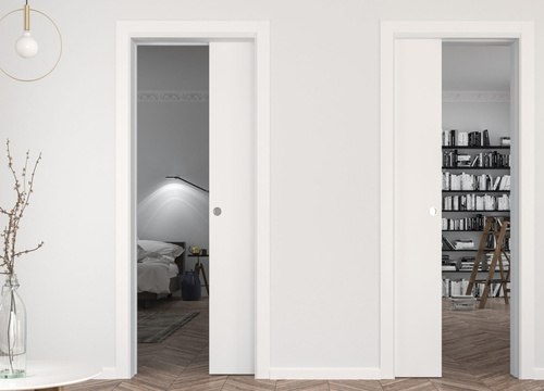 A pocket door system for two single doors in the same wall