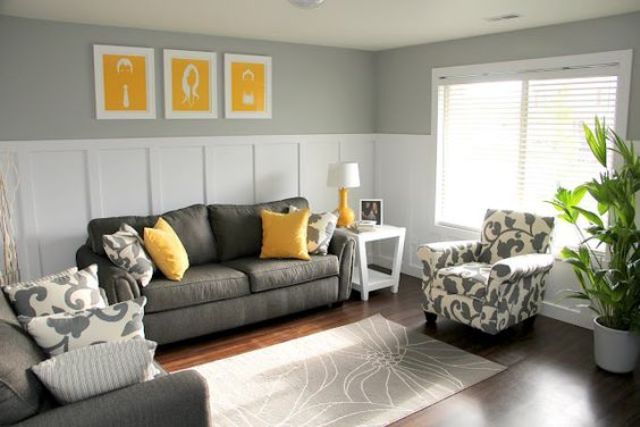 11 charcoal grey sofa and chair, yellow pillows and art pieces