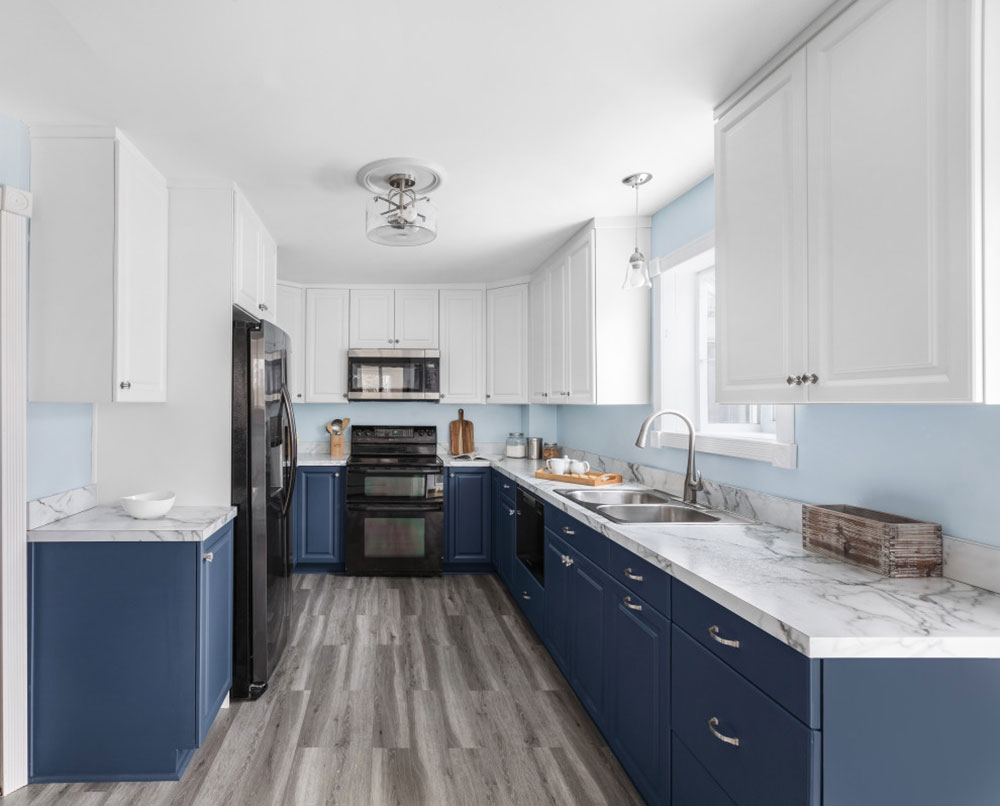 Blue-White-Cabinets-with-Gray-Details-from-Kitchen-Magic How to Paint Laminate Kitchen Cabinets (A Quick Start Guide)