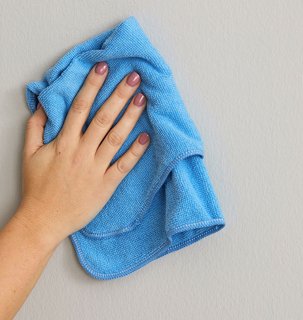 wet cloth How to clean walls with flat paint without ruining them
