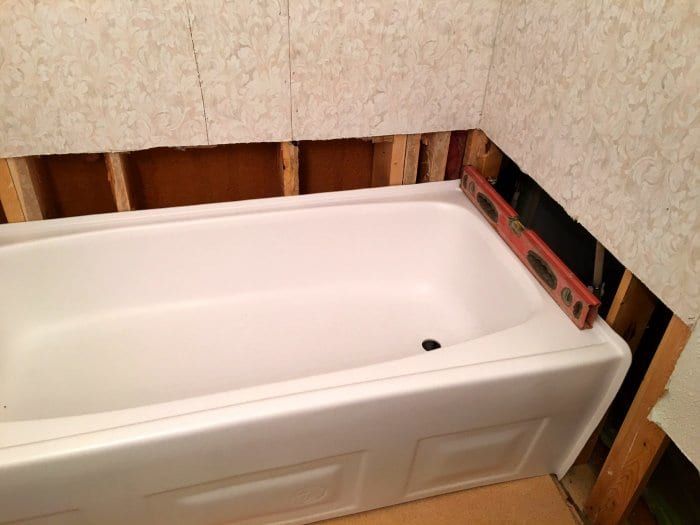How to Install a Bathtub | Installing bathtub, Refinish bathtub .
