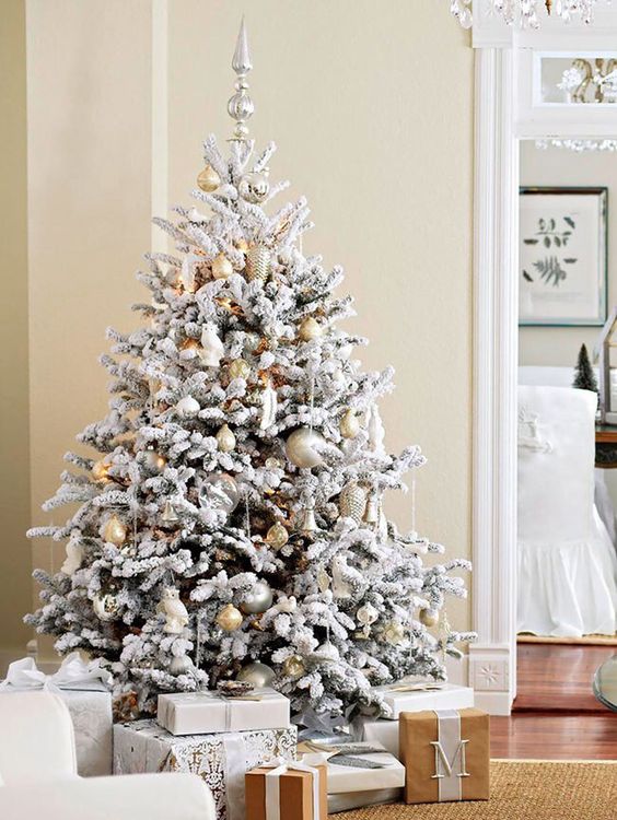 gold and silver ornaments look neutral and chic on a flocked tree