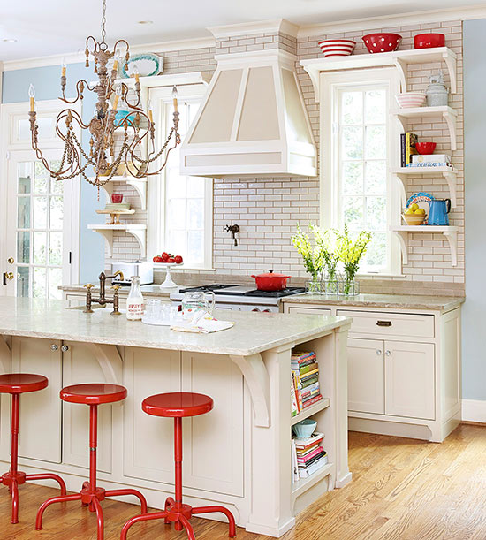 a fancy eclectic kitchen presents refined details and relaxed furniture plus a playful chandelier