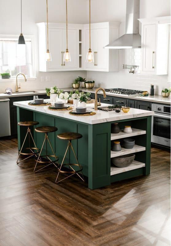 a stylish dark green and white kitchen with brass touches and dark stools plus marble countertops for a bold look