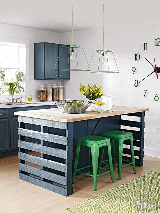 warehouse pallets and green metal stools are paired with vintage-inspired navy cabinets and butcherblock countertops