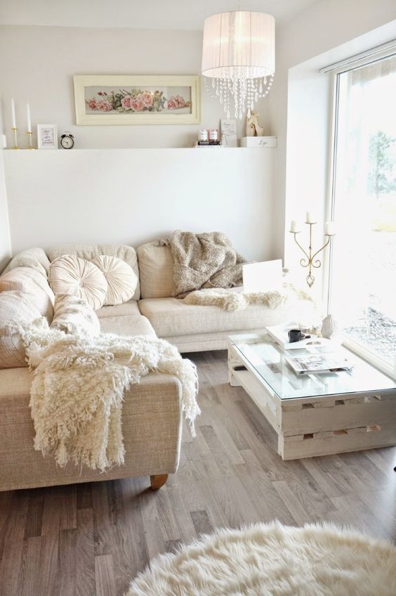 cozy white and neutral living room with light brown floor