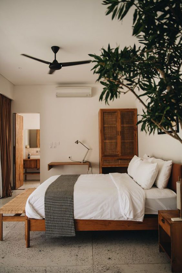 Nature-inspired bedroom villa with houseplants
