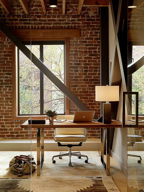 Industrial home office design with brick walls