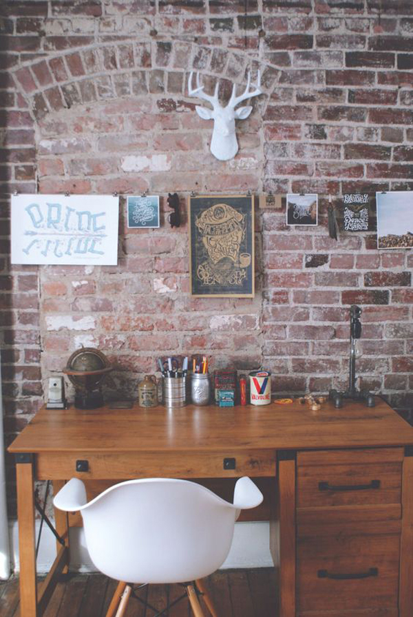Industrial style home office with brick walls