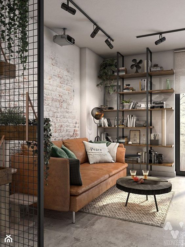 Industrial style living room with leather sofa and exposed brick