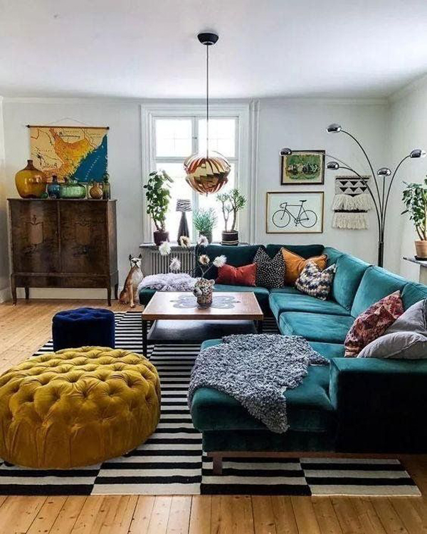cozy-eclectic-living-room-with-blue-velvet-sofas-and-striped-carpets