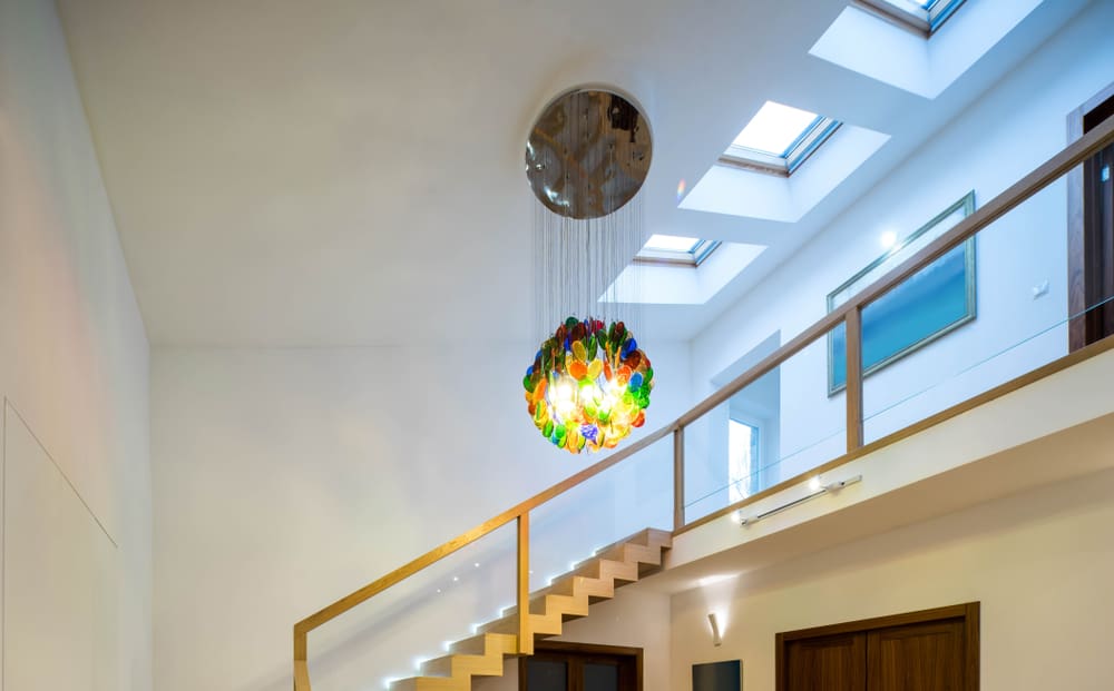 Colorful chandelier above the stairs 