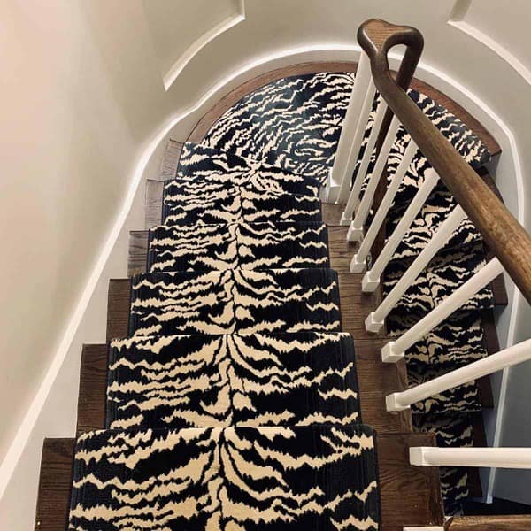 Stair runner with black and white pattern