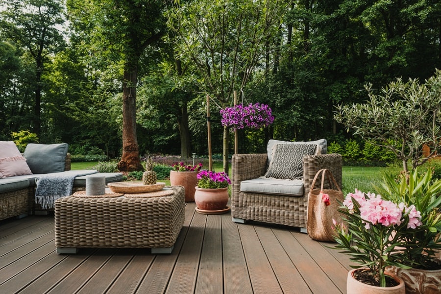 Wooden terrace with wicker furniture 