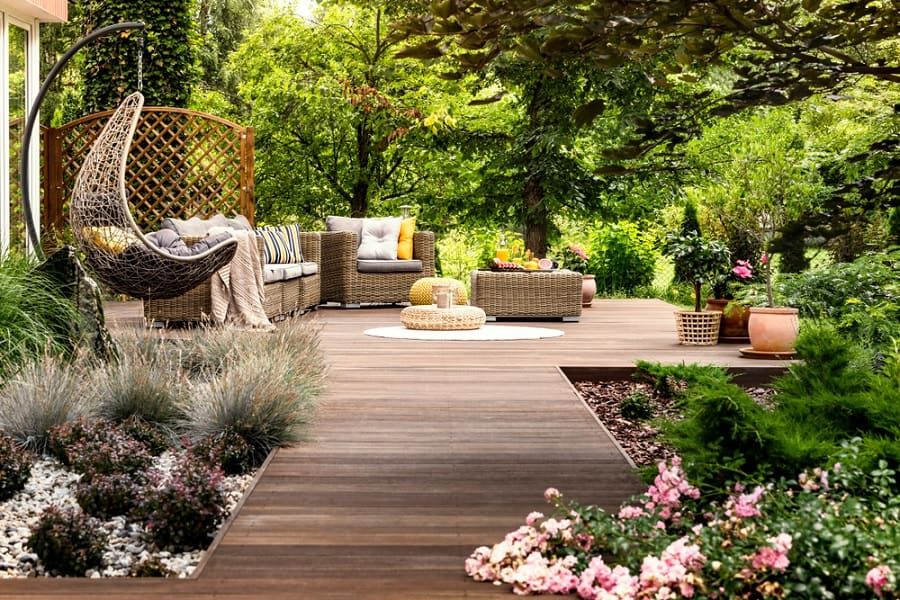 Wooden terrace with wicker furniture