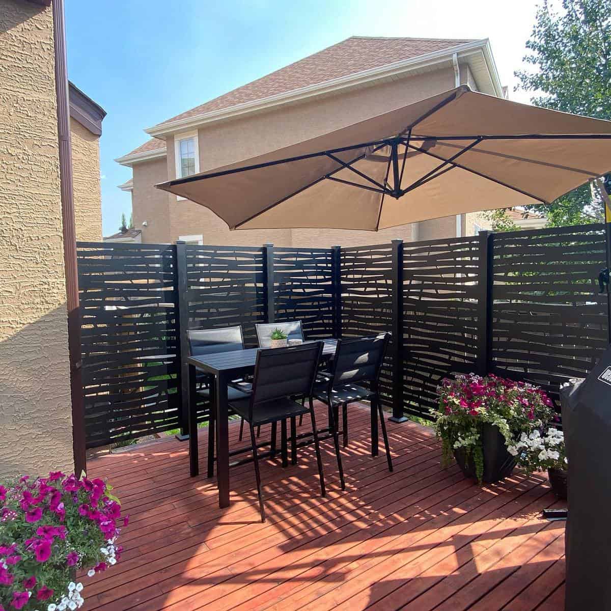 Wooden terrace with black fence 