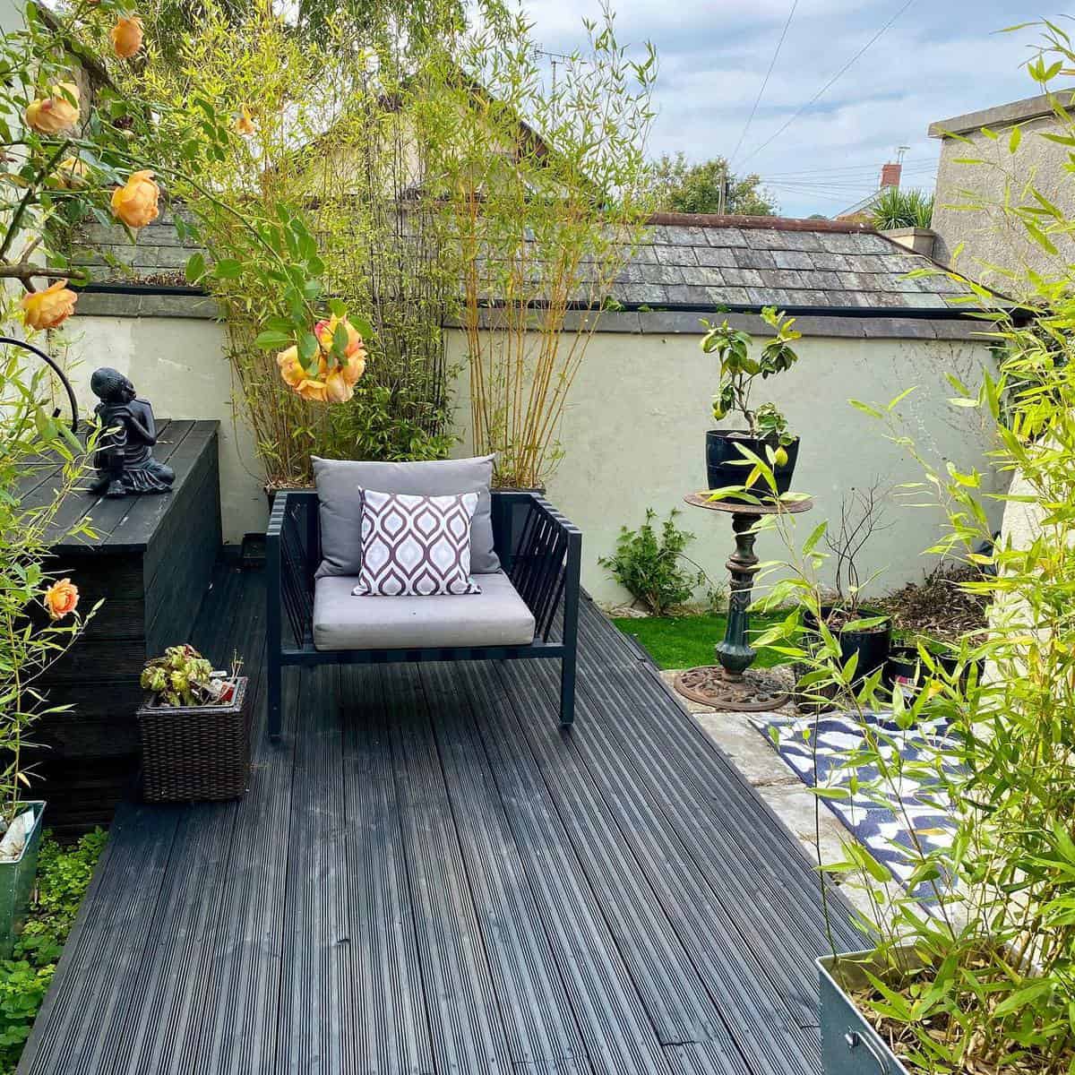 Asian themed garden with gray deck 