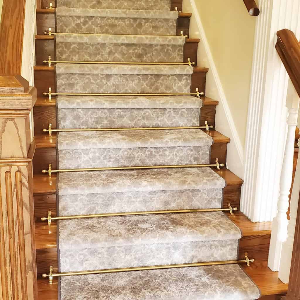 Stair runner with a gray pattern and ornate decorations 