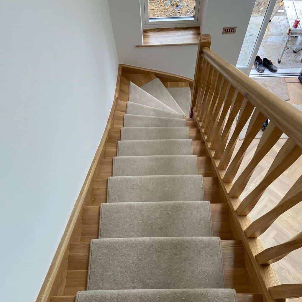 Wooden stairs with neutral stair runners