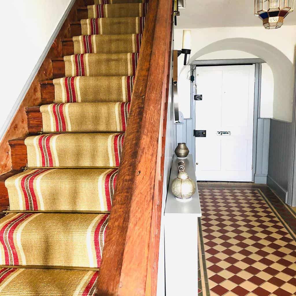 Striped stair runner, wooden stairs 