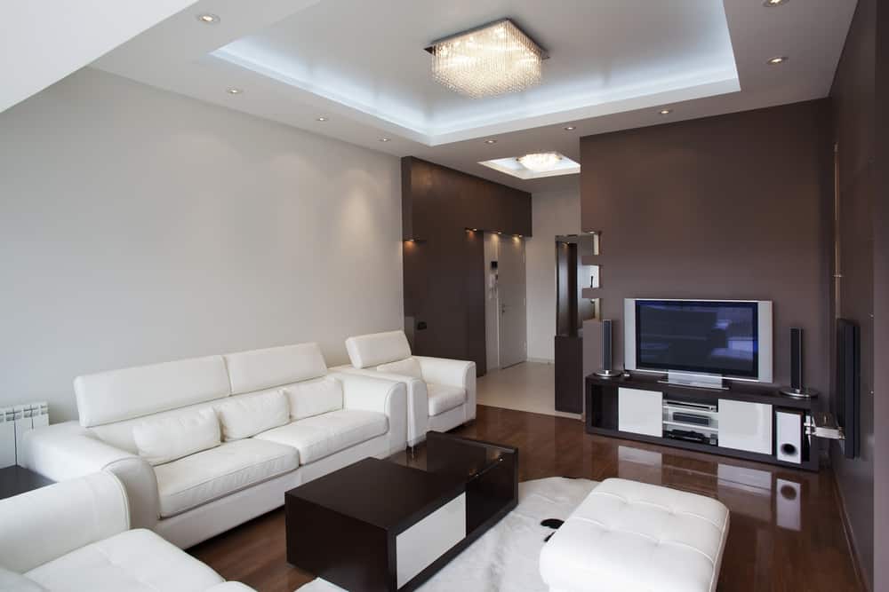 Modern apartment living room with brown wall and white couch