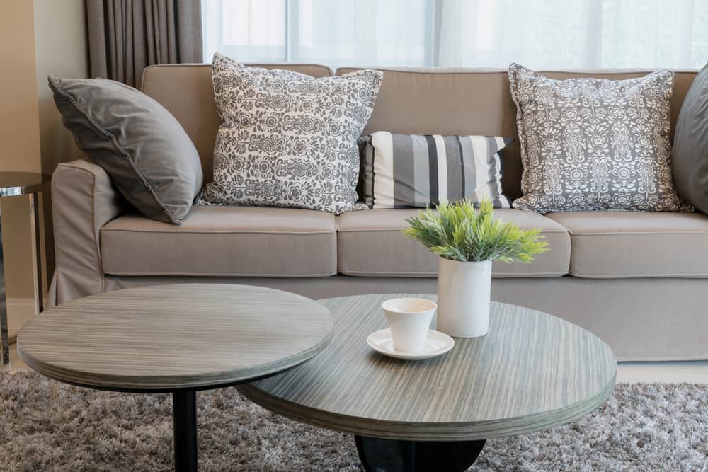 gray sofa pattern cushions, small tables