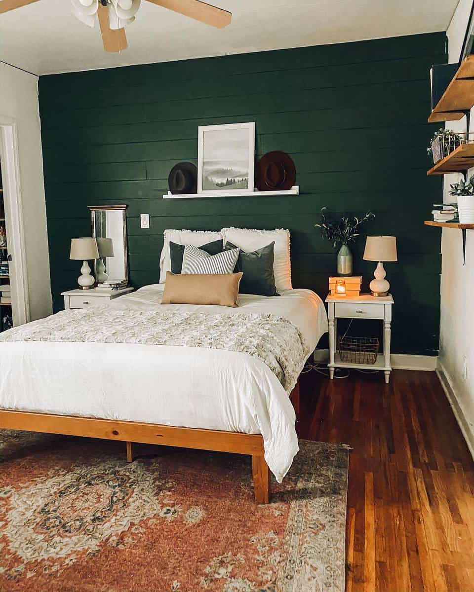 Shiplap green accent wall, white wall shelf, bedside tables, wooden floor, carpet 