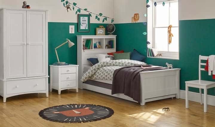 Two-tone green and white wall for boys, white bed frames, cupboards and bedside table 