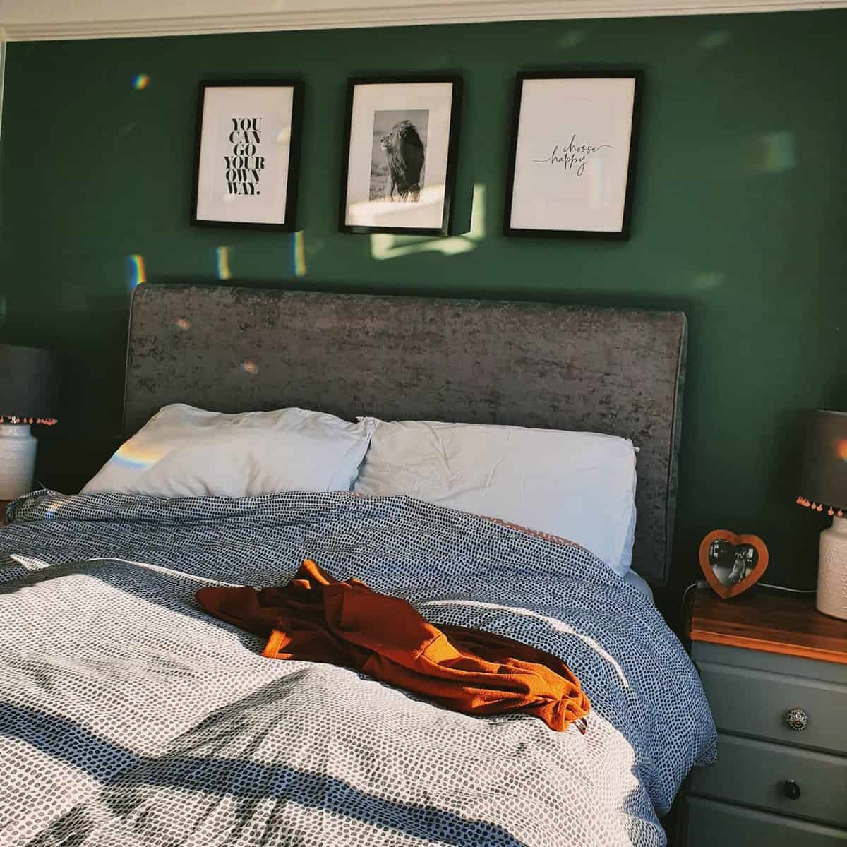 Green wall, bedroom, gray bed, framed wall art