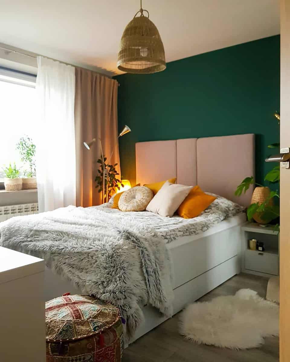Girl's room, green accent wall, modern bed, gold lamp, potted plants 