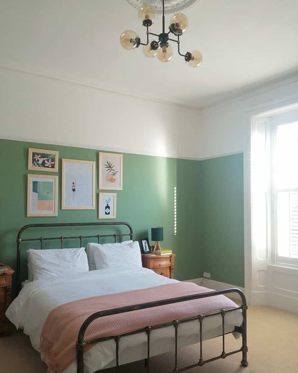 minimalist green bedroom, vintage bed frame, framed wall art, sputnik chandelier