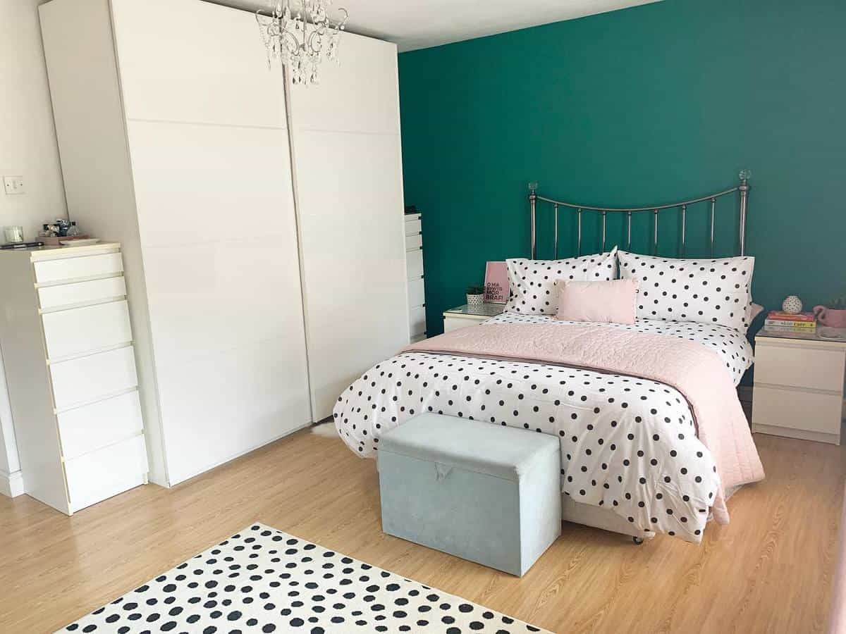 Dark green accent wall for girls bedroom, white cabinets and wardrobe 