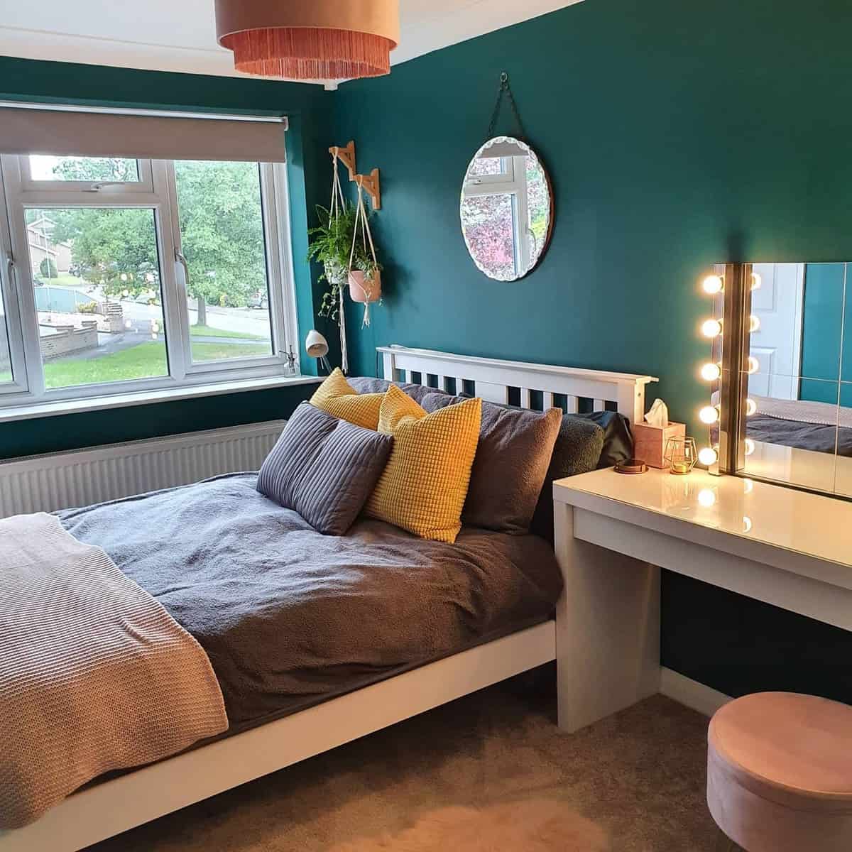 Green girl's bedroom, white bed frame, Hollywood style vanity with wall mirror 