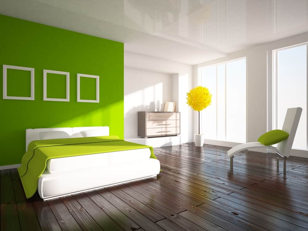 Light green artwork, white bed frame and label 