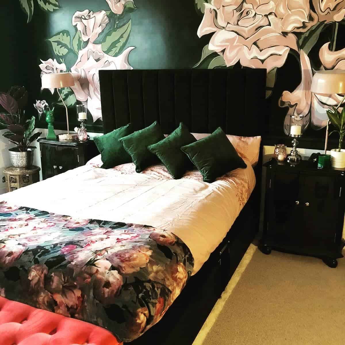 Luxury bedroom, black headrest, green pillows, floral wallpaper 