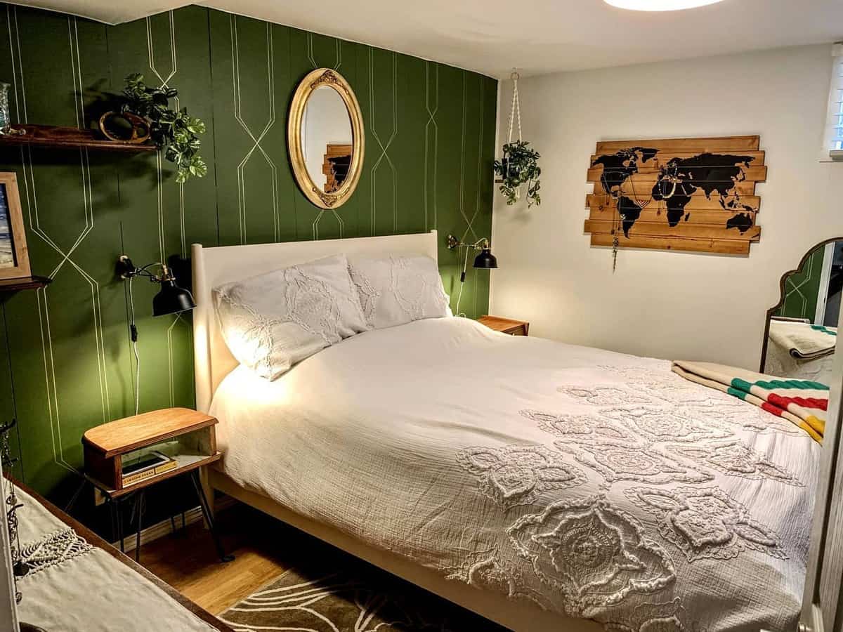 Rustic bedroom, green wallpaper, wall mirror, world map 