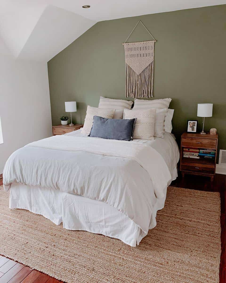Attic bedroom with green wooden wall bedside tables 