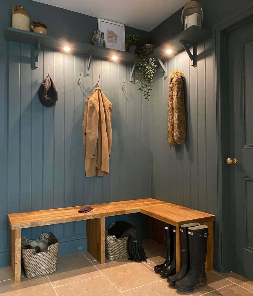 Gray wood wall paneling, wooden bench for hanging coats 
