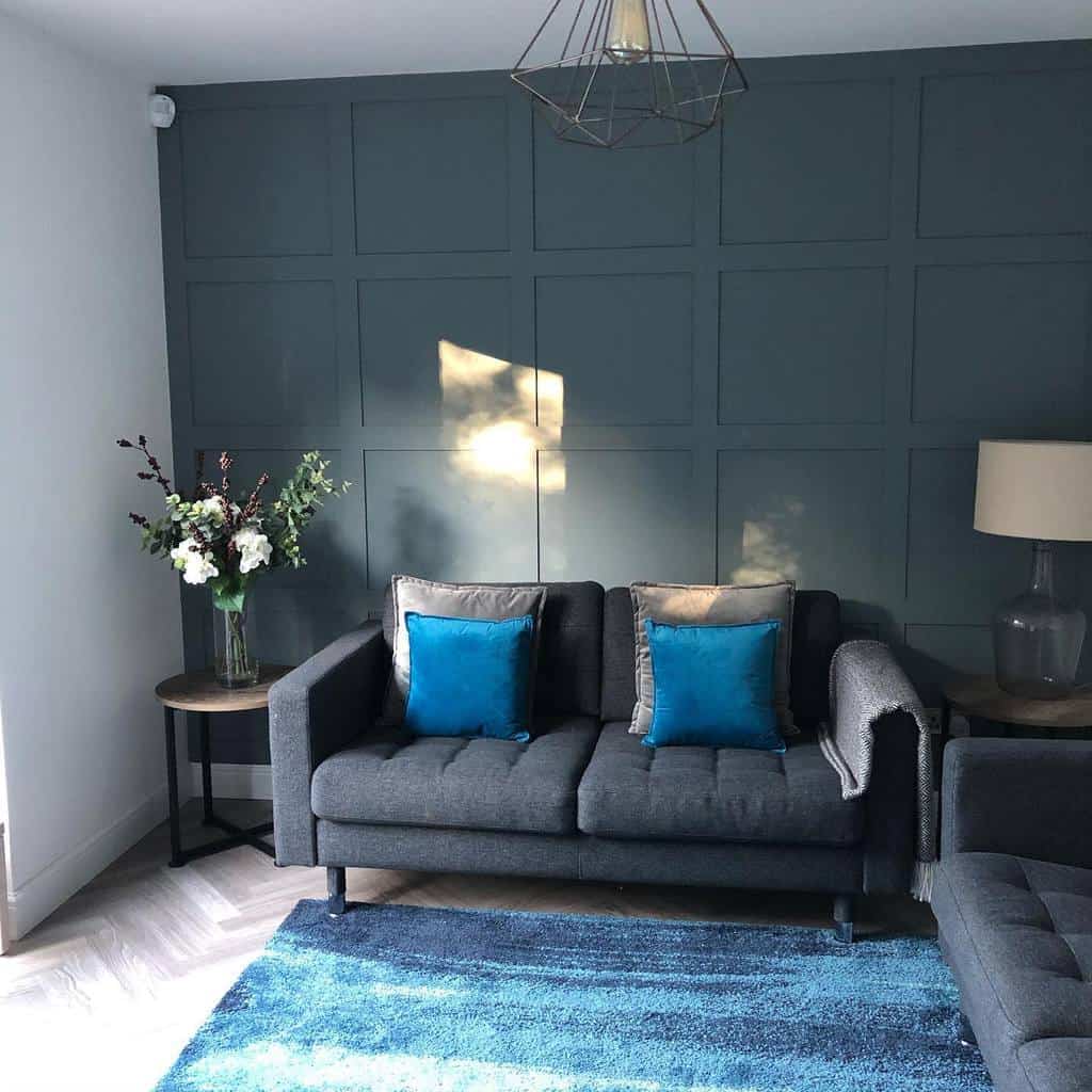 Gray wood paneling wall, living room, gray sofa 