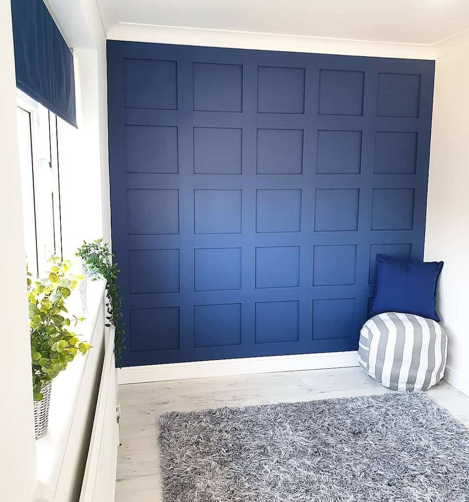 Living room with blue wall paneling 