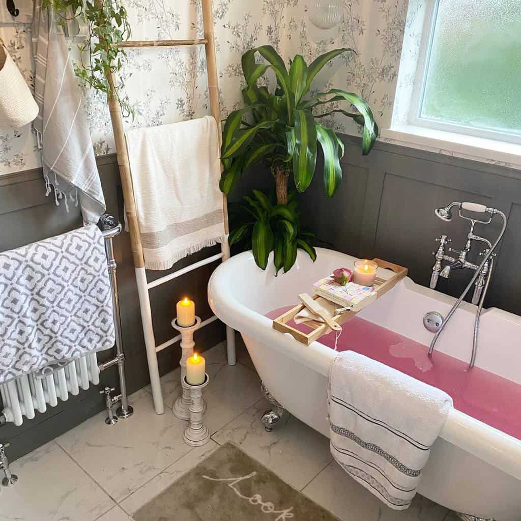 Bathroom with floral wallpaper, gray wall paneling, freestanding claw bathtub
