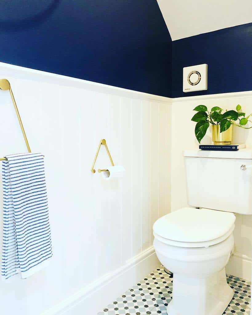 Bathroom, white wall paneling, blue wall-mounted toilet 