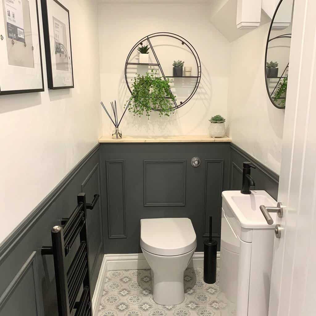 White wall, gray paneling, small modern guest toilet