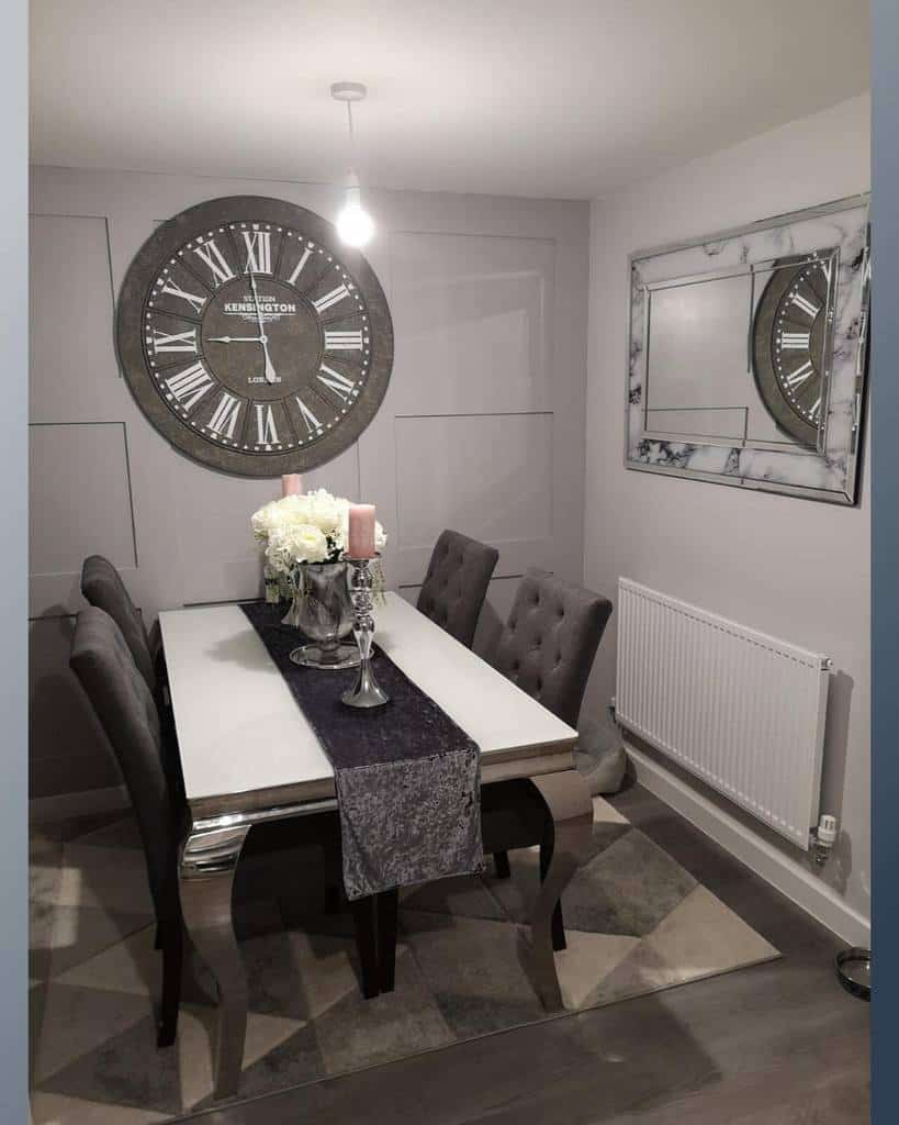 Dining room with large wall clock and mirror 