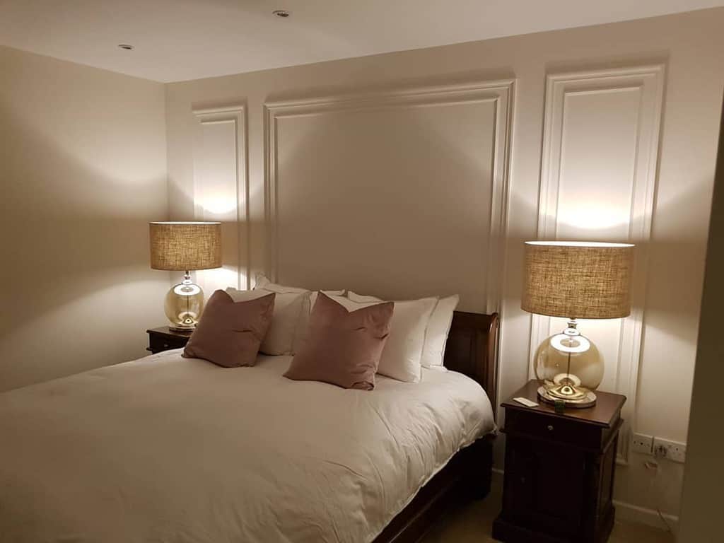 White wall paneling in the bedroom 
