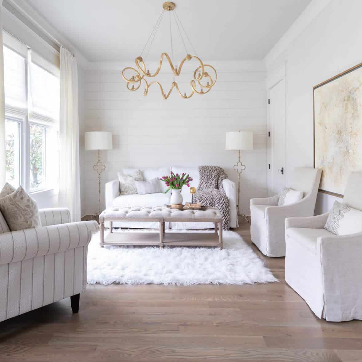 White living room, white sofas and floor carpet