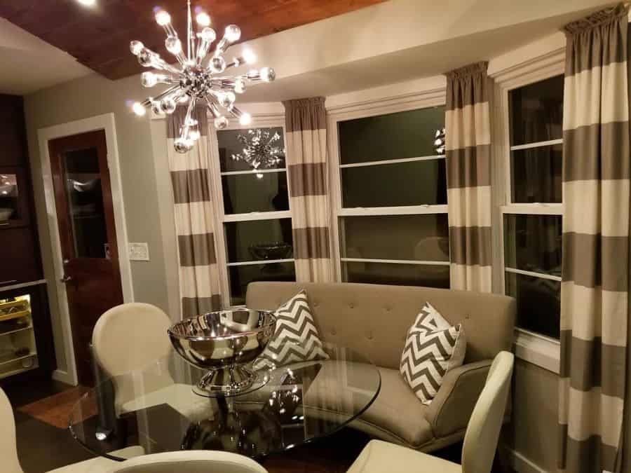 modern living room with glass table and gray sofa