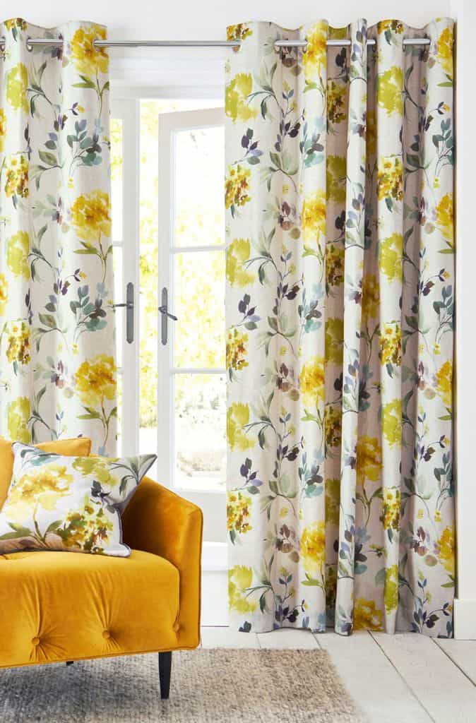 Yellow floral living room curtains with accent chair 