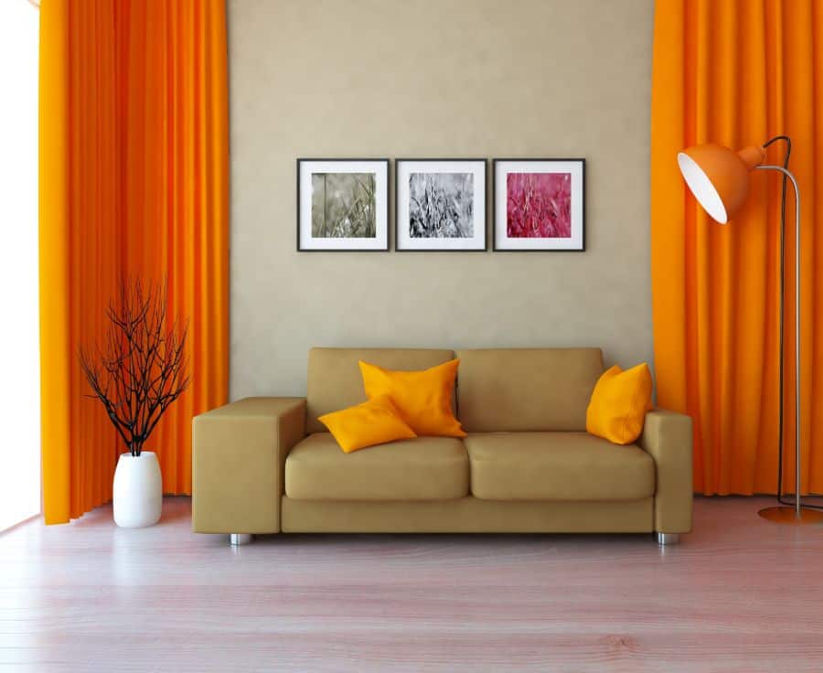 Orange curtains and beige sofa in the living room