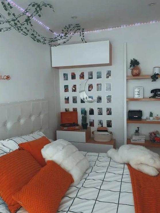 a chic teen room with a neutral bed, some storage, lights, a gallery wall and floating shelves, and bright bedding